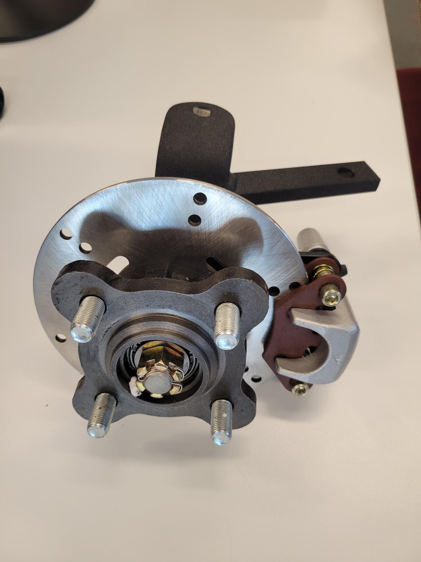 SPINDLE, FRONT, DRIVERS SIDE, WITH BRAKES, NEW STYLE PEAK/ANTHEM