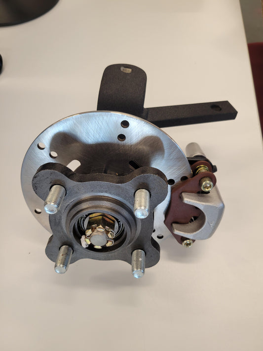 SPINDLE, FRONT, DRIVERS SIDE, WITH BRAKES, NEW STYLE PEAK/ANTHEM